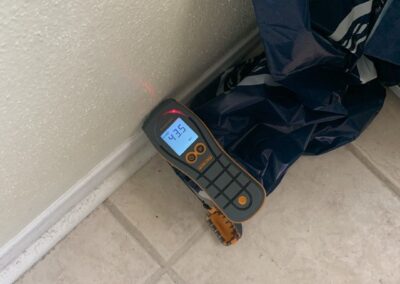 Digital tire inflator reading 37.5 PSI beside bag.
