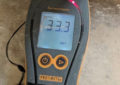 Protimeter moisture meter displaying wet condition.