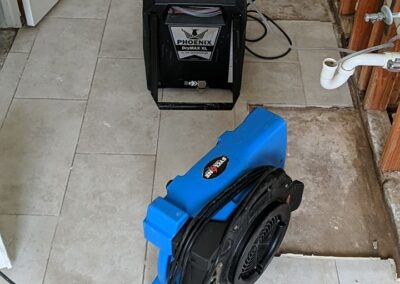 Water damage restoration equipment in house.